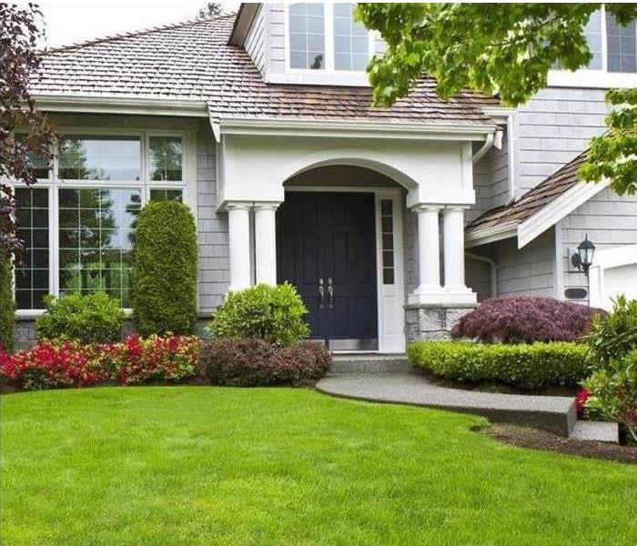 Beautiful landscaped house front view